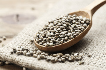 cannabis seeds in a wooden spoon