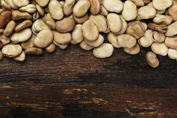 raw beans are scattered in a row