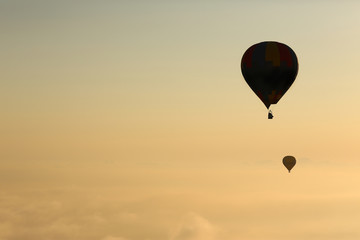 Hot air balloons, atmosphere ballons flying over mountain landscape at Mallorca in the sunrise