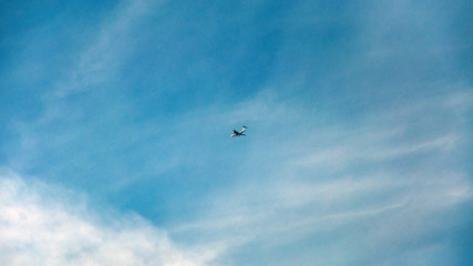 The flight of the aircraft in the blue sky day