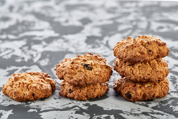Sweet cookies arranged in pattern on light textured background, close-up, shallow depth of field, selective focus.