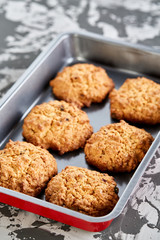 Fresh baked biscuits on a cookie sheet, top view, close-up, selective focus, shallow depth of field.