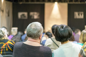 Residents in the theater are waiting for the beginning of the performance. The concept of cultural development