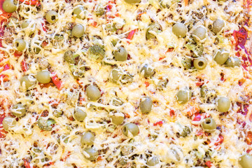 Freshly baked pizza with lots of cheese and vegetables