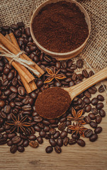 A cup of latte coffee and coffee beans. Toning.