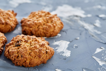 Sweet cookies arranged in pattern on light textured background, close-up, shallow depth of field, selective focus.