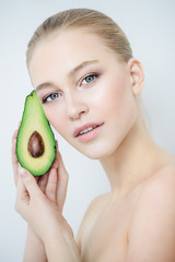 young woman with avocado