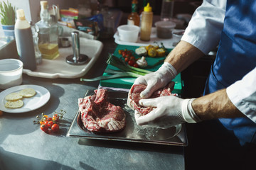 Chef cutting fresh vegetables for salad