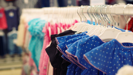 Children's clothing in the store. Dress for girls