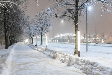 Heavy snowfall in Moscow. Night view of parks and avenues during a snowfall. Collapse of public services