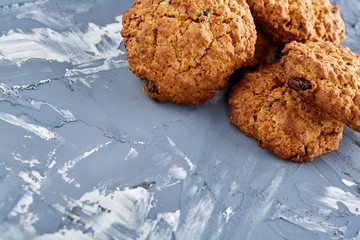 Sweet cookies arranged in pattern on light textured background, close-up, shallow depth of field, selective focus.