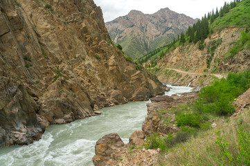 The Naryn river flowing between the stern cliffs