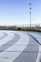 Background image of blue lanes on a running circuit