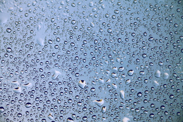 Raindrops on window glass , rainy day