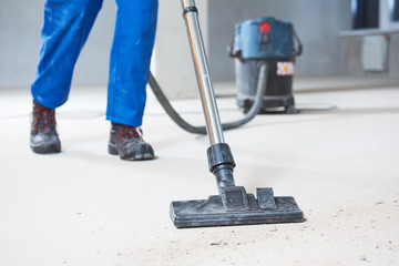 building cleaning service. dust removal with vacuum cleaner