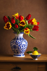 Still life with colorful tulips in the chinese vase