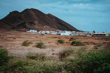 Local dwelling in front of Calhau volcanic crater, Cape Verde - Sao Vicente Island. Single martian...