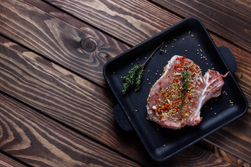 Raw ribs with herbs and spices.