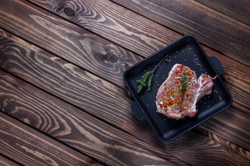 Raw ribs with herbs and spices.