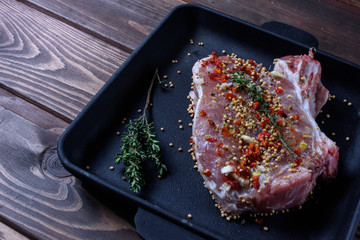 Raw ribs with herbs and spices.