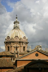Fototapeta na wymiar sky with gray clouds and roofs of the Rome Italy
