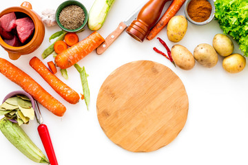 ingredients for vegetable ragout cooking on white table background top view mock-up