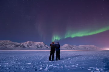 Poster The polar arctic Northern lights aurora borealis sky star in Norway Svalbard in Longyearbyen city man people mountains © bublik_polina