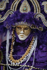woman in masquerade mask and dress at the Italian Venice carnival Italy