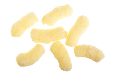 Sweet crunchy corn sticks or snacks isolated on white background. Top view. Flat lay