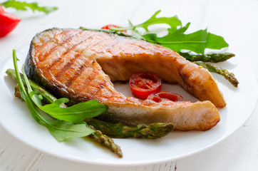 Grilled salmon steak with vegetables