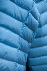 Fototapeta na wymiar closeup of blue winter coat in fashion store showroom