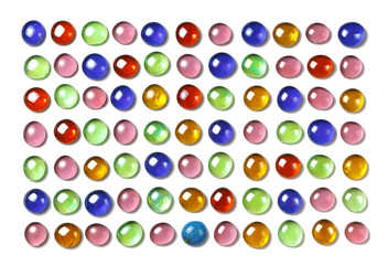 Pattern of colorful, shiny glass beads. Isolated on white. Spa background, texture