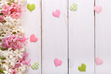Spring background with colorful butterflies ,hyacinth flowers on white wooden board with copy space