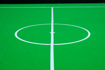 Close-up center of soccer field on indoor for robot soccer competition, On the ground floor is covered with green flannel