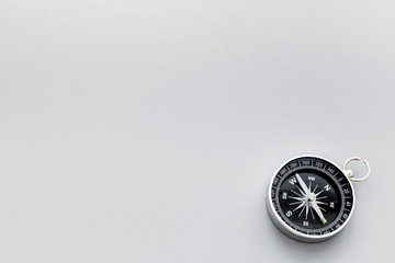 Obraz na płótnie Canvas Direction concept with compass on gray background top view mockup