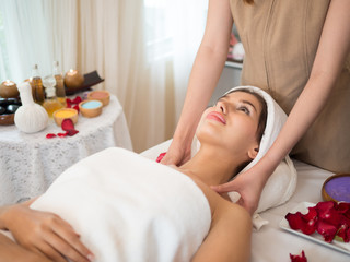 Fototapeta na wymiar image of Beautiful young woman receiving massage in spa salon