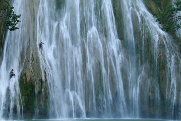 men jumping from the Lemon waterfall samana dominican republic