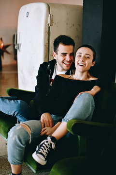 Happy and satisfied, cute young teenagers, in trendy awesome outfits live influencer blogger lifestyle, forever free and inspiring true emotions and feelings, sit in trendy loft apartment