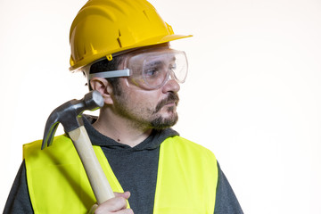 Occupation, Do it yourself, man dressed in yellow builder helmet with protective glasses ready to...