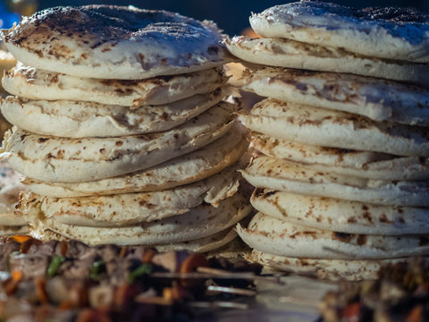 Tw piles of chapati. Typical food on Forodhani Market in Stone Town.  Zanzibar, Tanzania, February 2018.