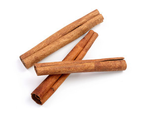 Cinnamon sticks isolated on white background. Top view