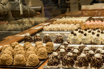 Showcase pastry shop. Cakes, sweets and desserts are on the counter of the pastry shop. Assortment...
