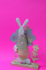 Easter bunny decoration on bright pink background