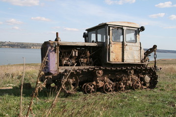 old steal tractor in the field