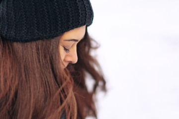 young woman covered her eyes in winter, close-up face and eyelashes
