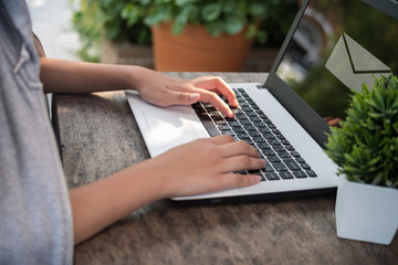 Woman used laptop to sent email for her business, technology concept