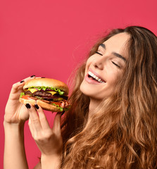 Woman hold barbecue burger sandwich with hungry mouth on pink red background