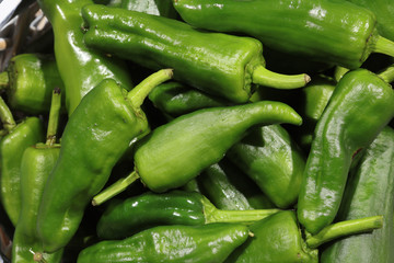Fresh organic green Peppers called Pimientos in a Basket