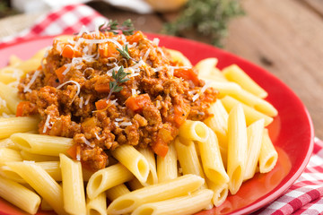 Spaghetti bolognese. Spaghetti served with a sauce of ground beef meat, tomato, onion, carrot and thyme. Traditional italian cuisine