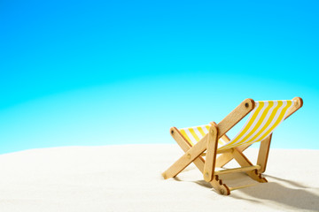 Sun lounger on the sandy beach